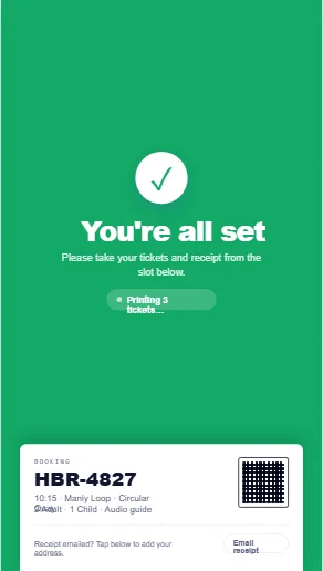 JetSetGo self-service kiosk confirmation screen — booking complete, tickets printing